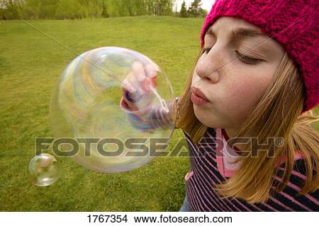 Child blows a bubble View Large Photo Image Picture - Child blows a bubble. Fotosearch