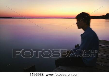 Stock Photo - Enjoying the view at the lake. Fotosearch