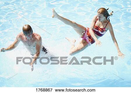 Stock Photo - Fun in the swimming pool. Fotosearch