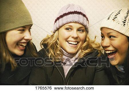 Stock Photograph - Girls laughing together. Fotosearch