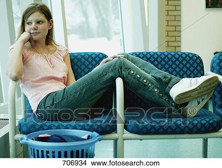 Student waits to do laundry View Large Photo Image Picture - Student waits to do laundry. Fotosearch