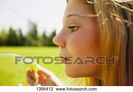 Teenager blows a bubble View Large Photo Image Stock Image - Teenager blows a bubble. Fotosearch