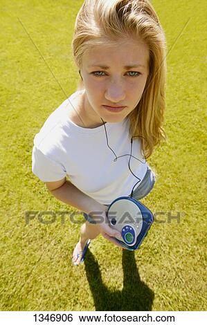Stock Photograph - Teenager listens to Discman. Fotosearch