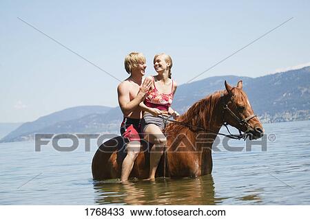Teenagers on horseback View Large Photo Image Stock Image - Teenagers on horseback. Fotosearch