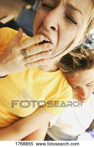 Stock Photography - Tired teenagers. Fotosearch