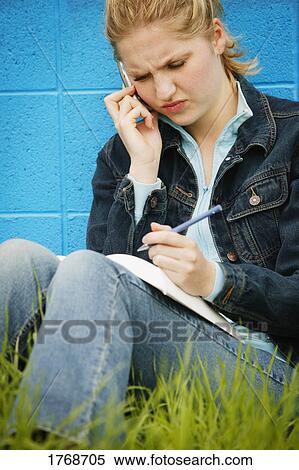 Stock Photography - Working on homework. Fotosearch