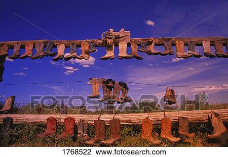 Cowboy boots on fence Great Sand hills Saskatchewan Canada View Large Photo Image Stock Image - Cowboy boots on fence Great Sand hills Saskatchewan Canada. Fotosearch