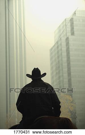 Stock Image - Cowboy in the city. Fotosearch