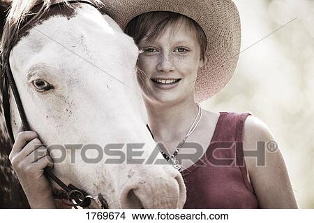 Picture - Girl with a horse. Fotosearch