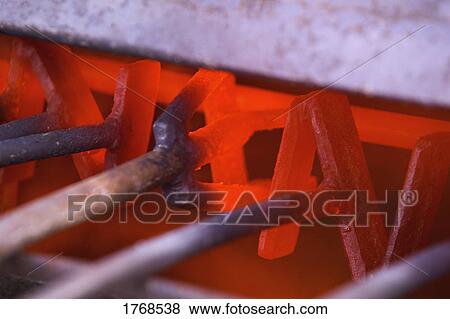 Heating cattle branding irons View Large Photo Image Stock Photo - Heating cattle branding irons. Fotosearch