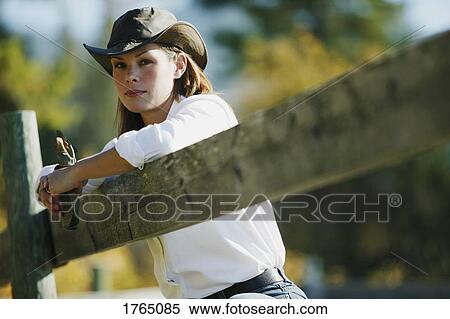 Stock Photography - Portrait of a cowgirl. Fotosearch
