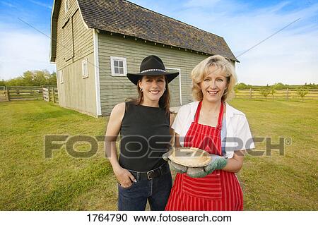 Woman holds a pie View Large Photo Image Stock Image - Woman holds a pie. Fotosearch