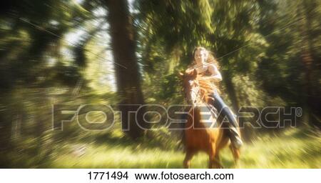 Picture - Woman riding horseback. Fotosearch