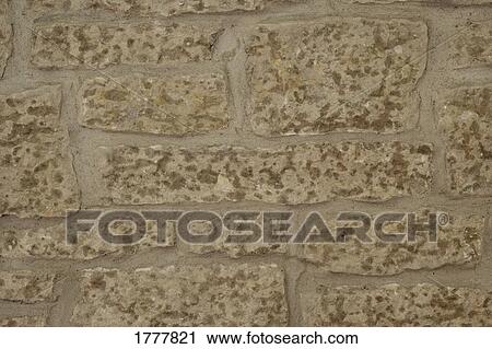 Stock Image - Close up of stone wall and moss. Fotosearch