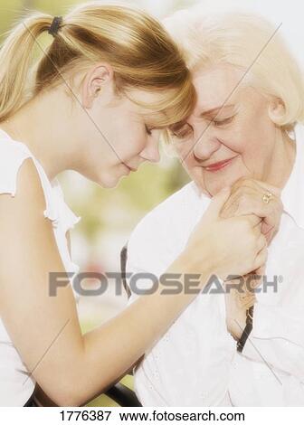 Grandma and granddaughter praying View Large Photo Image Stock Photo - Grandma and granddaughter praying. Fotosearch