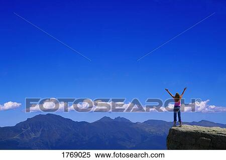 Stock Photography - Standing in awe of God's creation. Fotosearch