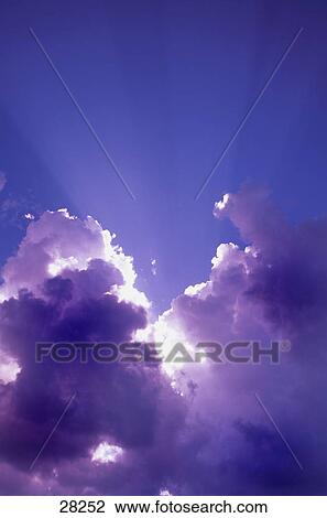Sun rays through the clouds View Large Photo Image Stock Image - Sun rays through the clouds. Fotosearch