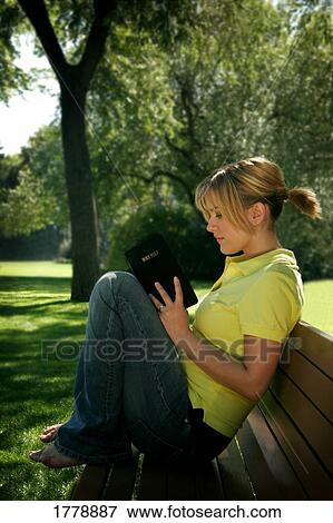 Stock Photo - Teenager reading the Bible. Fotosearch