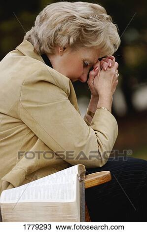 Woman prays View Large Photo Image Stock Image - Woman prays. Fotosearch
