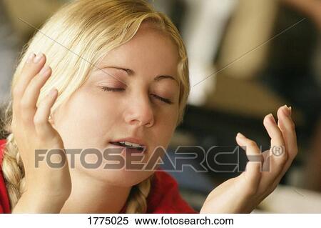 Woman with hands raised View Large Photo Image Stock Photography - Woman with hands raised. Fotosearch