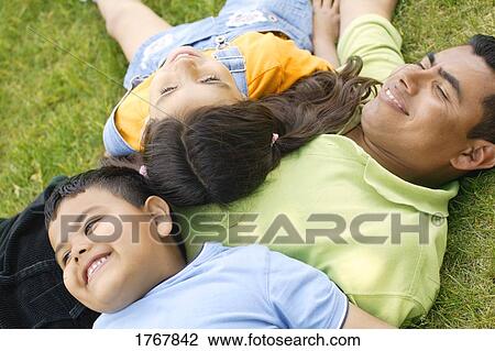 Stock Image - A family plays together. Fotosearch
