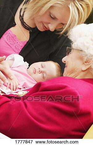A lady, a senior woman, and a baby View Large Photo Image Stock Photo - A lady, a senior woman, and a baby. Fotosearch