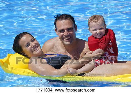 Picture - Family in swimming pool. Fotosearch