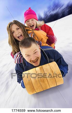 Family on sled View Large Photo Image Stock Photo - Family on sled. Fotosearch
