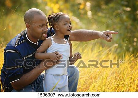 Stock Photo - Father and daughter go sight seeing. Fotosearch