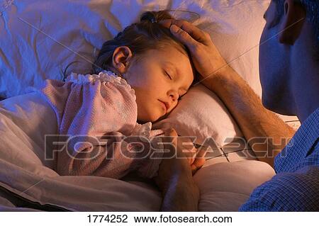 Father beside sleeping daughter bed View Large Photo Image Stock Image - Father beside sleeping daughter bed. Fotosearch
