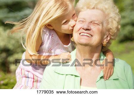 Grandma gets a kiss View Large Photo Image Stock Photography - Grandma gets a kiss. Fotosearch