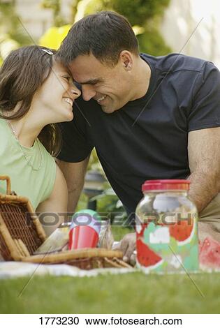 Loving couple at a picnic View Large Photo Image Stock Image - Loving couple at a picnic. Fotosearch