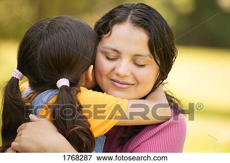 Stock Photo - Mother and daughter embrace. Fotosearch