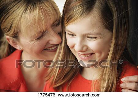 Mother and daughter share a hug View Large Photo Image Stock Photograph - Mother and daughter share a hug. Fotosearch