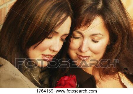 Mother and daughter share a moment View Large Photo Image Stock Photo - Mother and daughter share a moment. Fotosearch