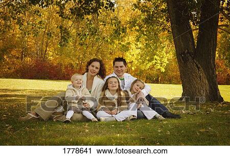 Portrait of a young family View Large Photo Image Stock Image - Portrait of a young family. Fotosearch