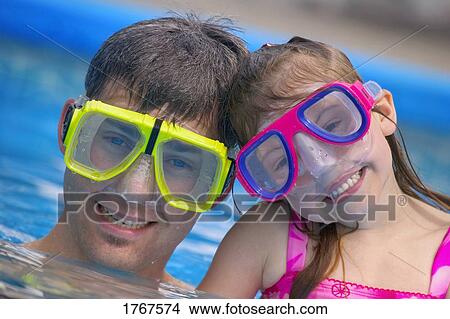 Picture - Portrait of Father and Daughter Snorkeling. Fotosearch