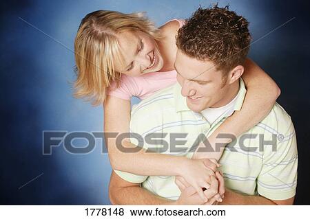 Stock Photo - A couple embrace. Fotosearch