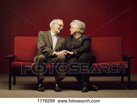 A devoted senior couple View Large Photo Image Stock Photograph - A devoted senior couple. Fotosearch - Search Stock Photography, Posters, Pictures, and Photo Clipart Images