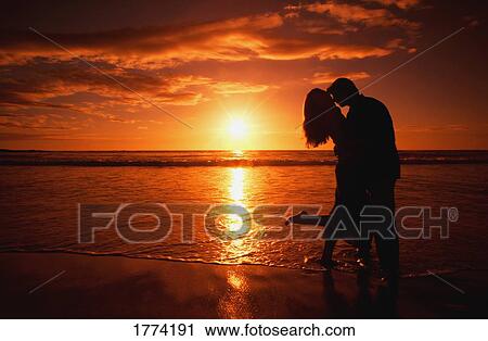 A honeymoon couple and sunset View Large Photo Image Stock Image - A honeymoon couple and sunset. Fotosearch