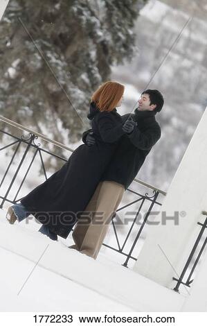 Stock Image - Couple dancing in snow. Fotosearch