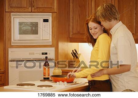 Couple in the kitchen View Large Photo Image Stock Photography - Couple in the kitchen. Fotosearch