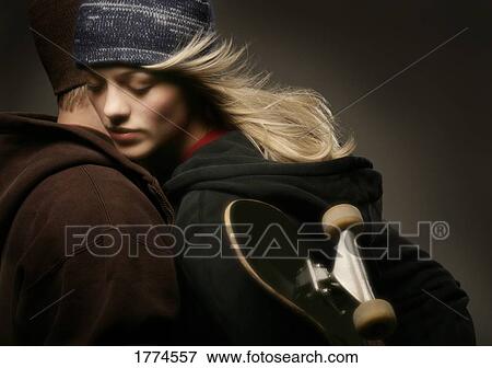 Couple with skateboard View Large Photo Image Stock Photo - Couple with skateboard. Fotosearch
