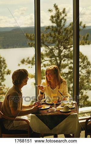Eating in a restaurant View Large Photo Image Stock Image - Eating in a restaurant. Fotosearch