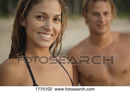 Happy couple on the beach View Large Photo Image Stock Image - Happy couple on the beach. Fotosearch