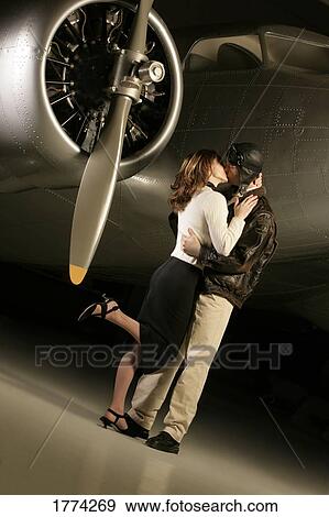Pilot kissing woman View Large Photo Image Stock Photo - Pilot kissing woman. Fotosearch