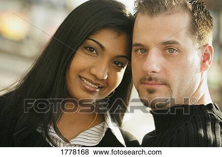 Stock Photo - Portrait of young couple. Fotosearch