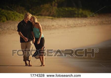 Romantic walk along the beach View Large Photo Image Stock Photo - Romantic walk along the beach. Fotosearch