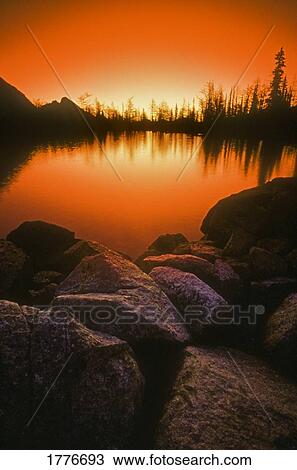 A pond at sunset View Large Photo Image Stock Image - A pond at sunset. Fotosearch