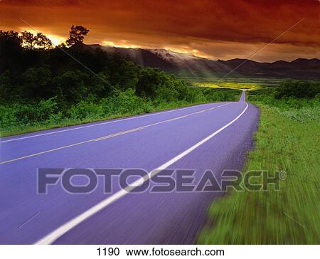 Blurred country road on cloudy day View Large Photo Image Stock Image - Blurred country road on cloudy day. Fotosearch